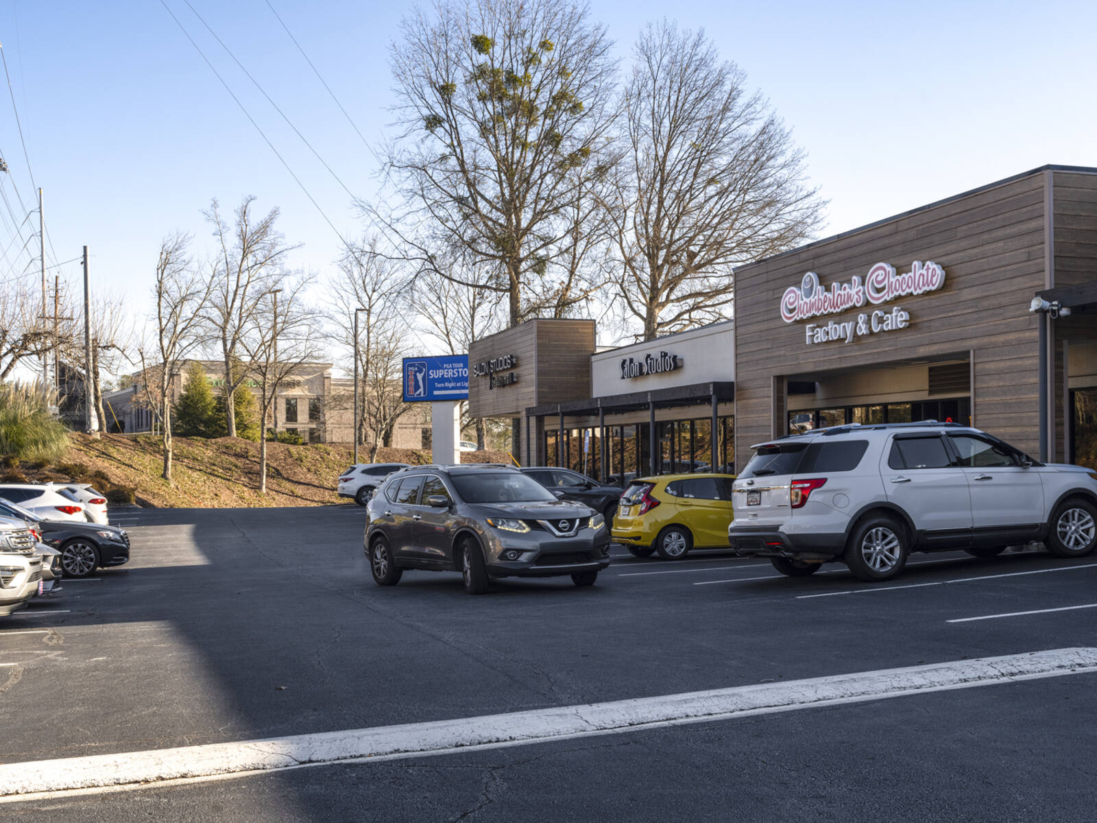 Chamberlain's Chocolate with SUV pulling out of parking spot.