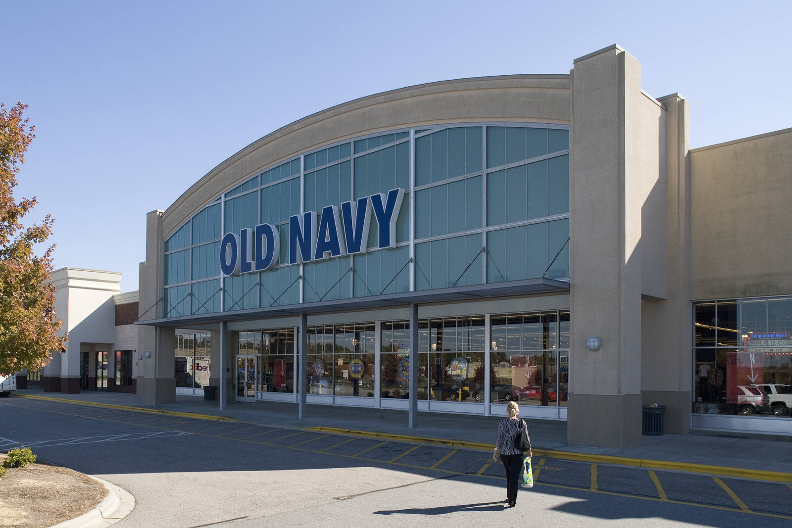 Woman walking in front of Old Navy