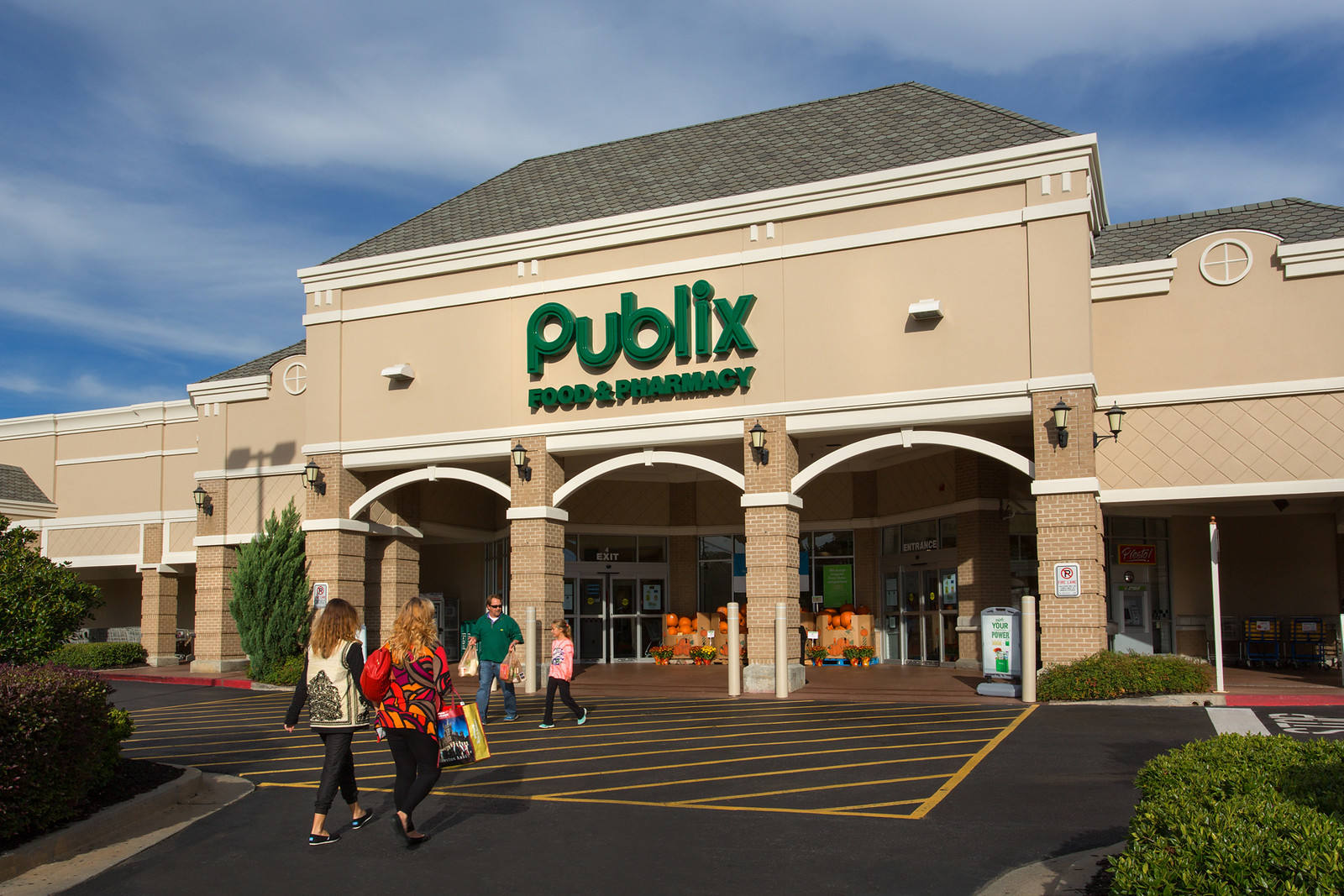 Two women walking towards the entrance of Publix
